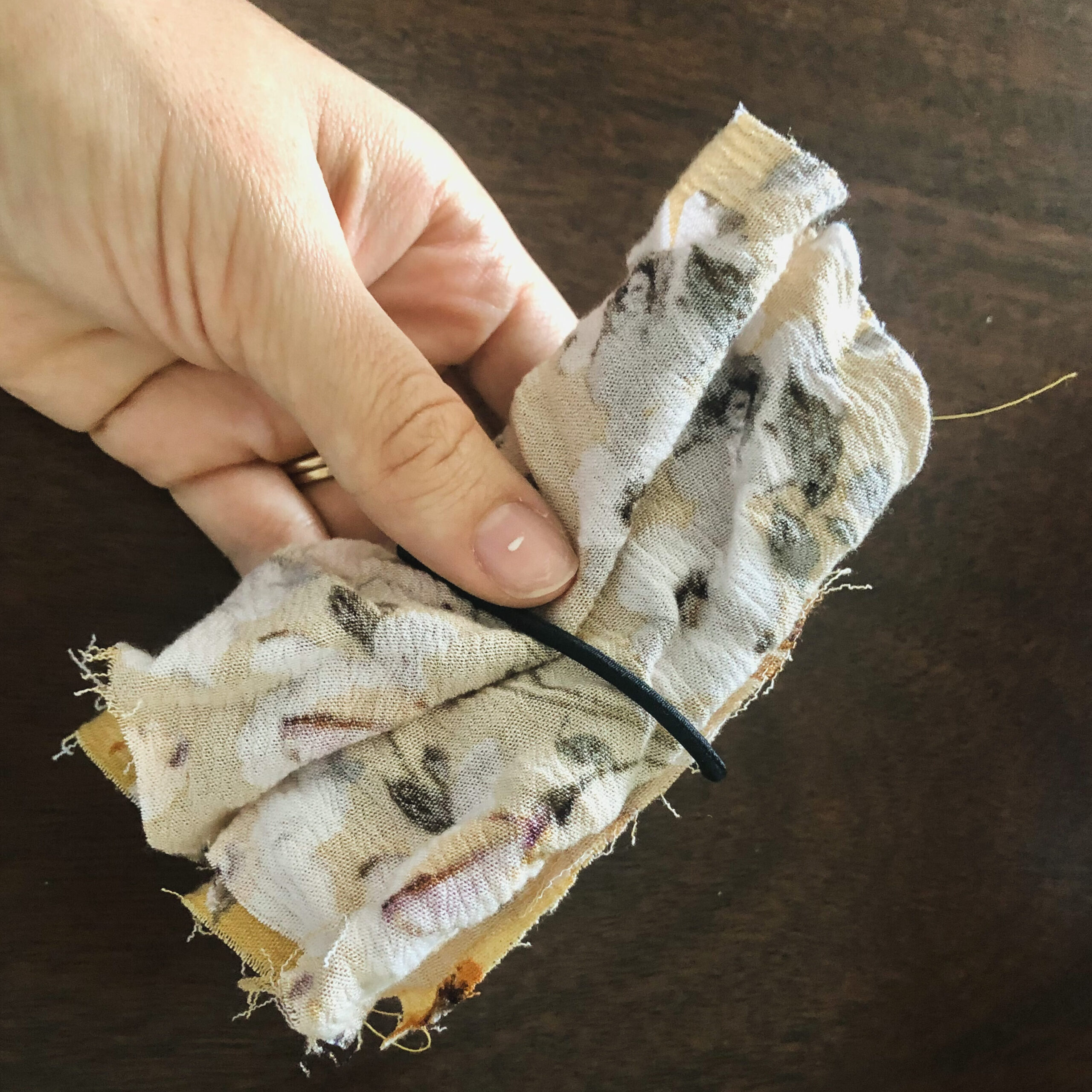 How to wrap the hair tie around the scrap fabric.