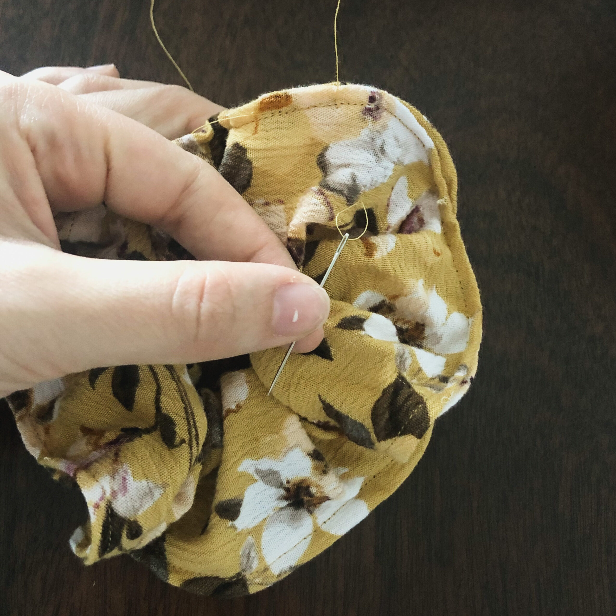 Hide the loose strings into the easy scrap fabric scrunchie