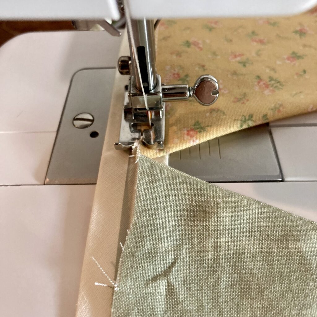 sew bunting triangles onto bias tape
